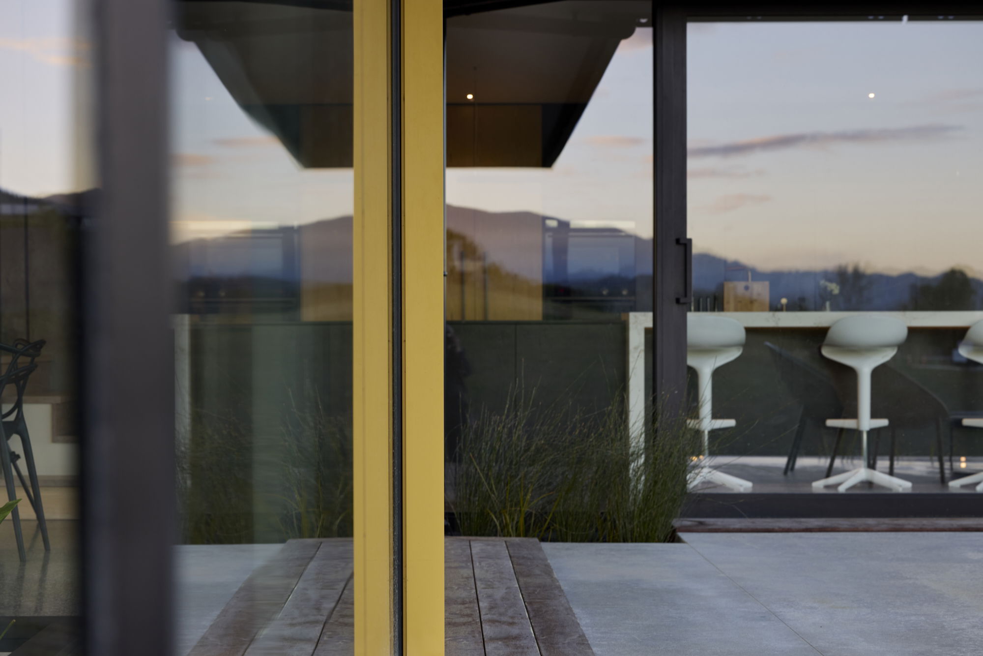 Close up image of FMI Building Innovation insulated glass units with yellow FMIBI aluminium profiles